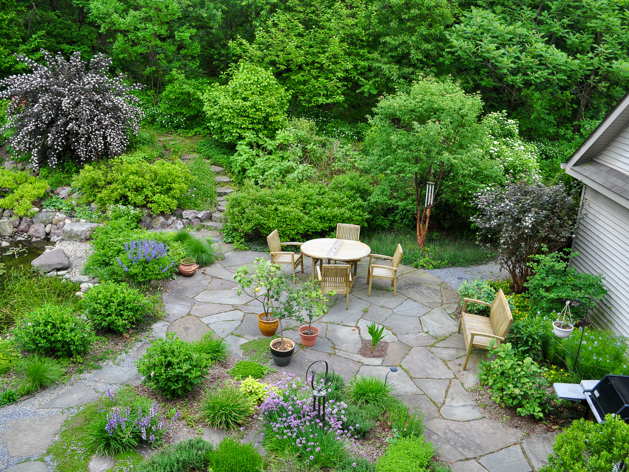 Overhead view of natural styled backyard patio area